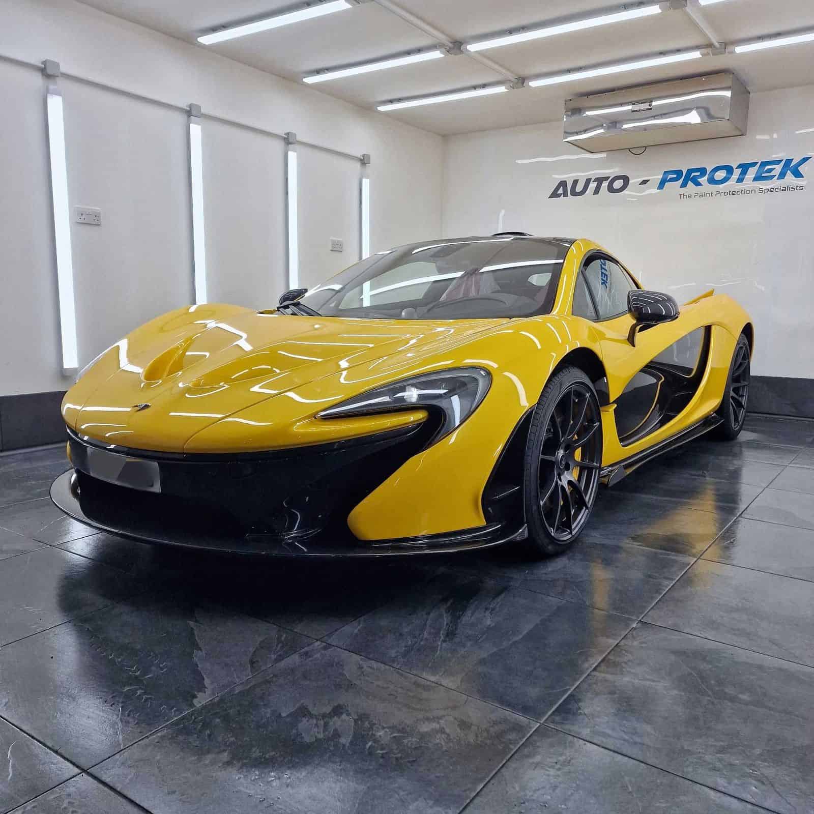 A yellow McLaren P1 with Xpel PPF protecting the whole car