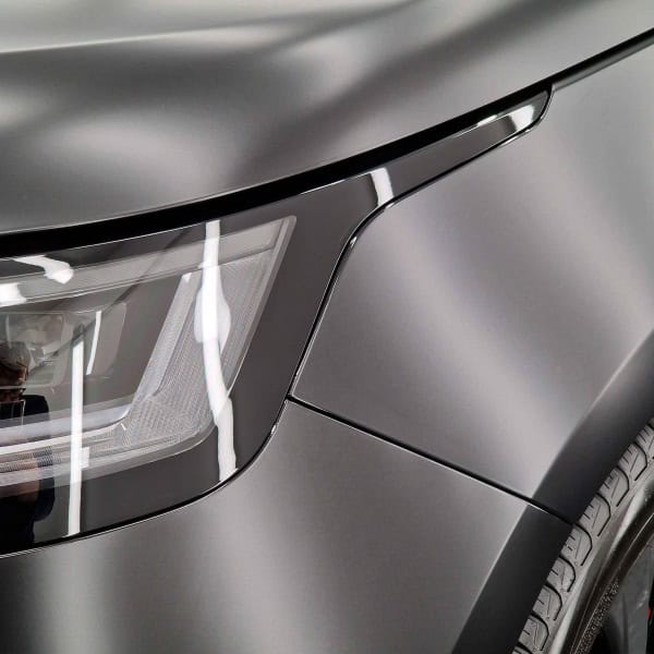 The front of a satin grey Range Rover sport.